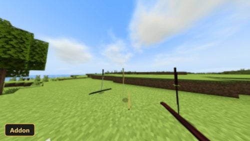 open grassy field, three swords stuck in the ground, clear sky