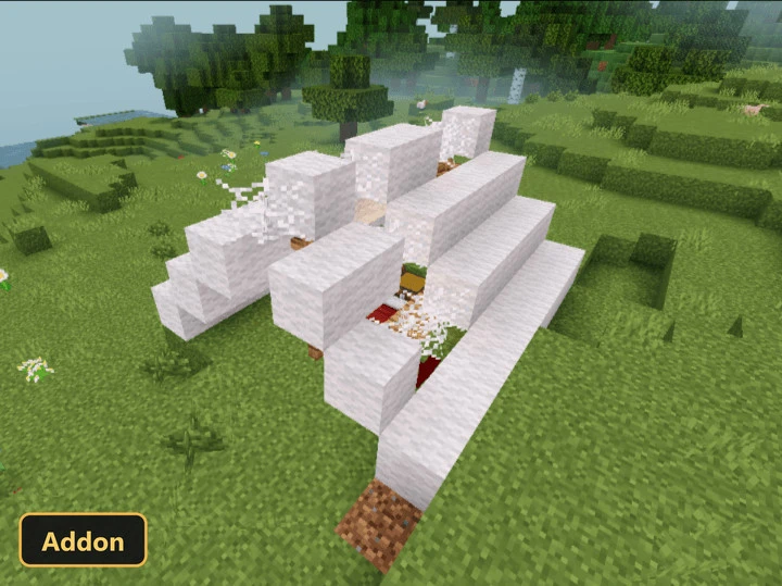 white wool structure with redstone and a chest in a grassy field
