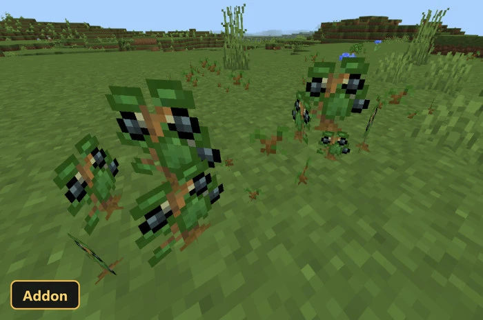 small green plant creatures with black eyes in a grassy field