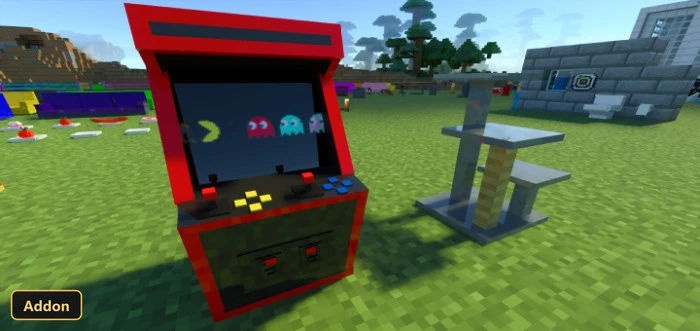 arcade machine and cat tree on grass