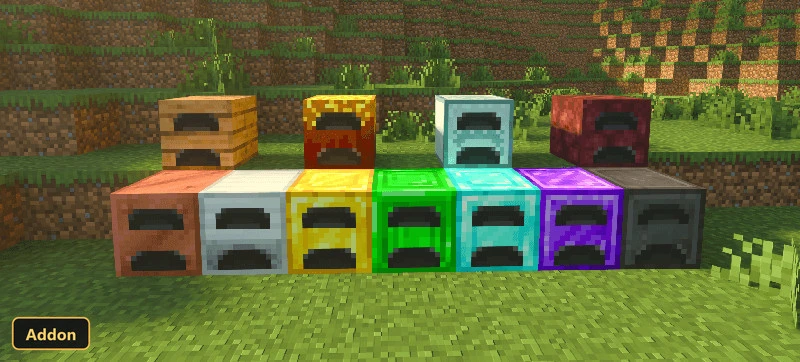 various colored smelters in a grassy field with trees in background