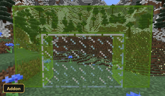 grassy field with blue flowers and snowy mountains in the background