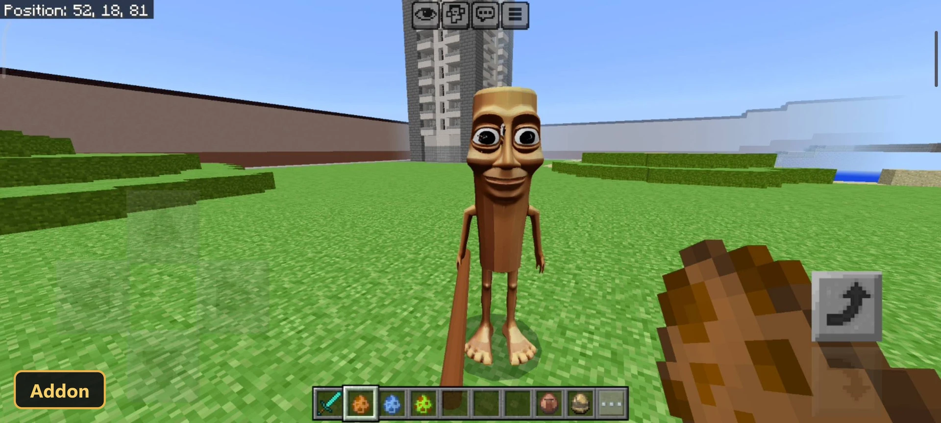 custom mob in open grass field with distant buildings