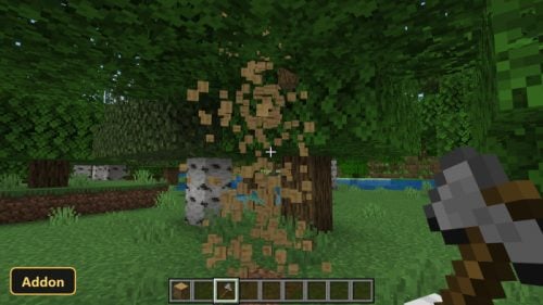 player chopping a tree in a forest, wood particles flying
