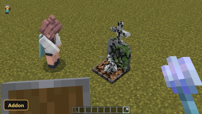 player character next to a gravestone on a grassy field
