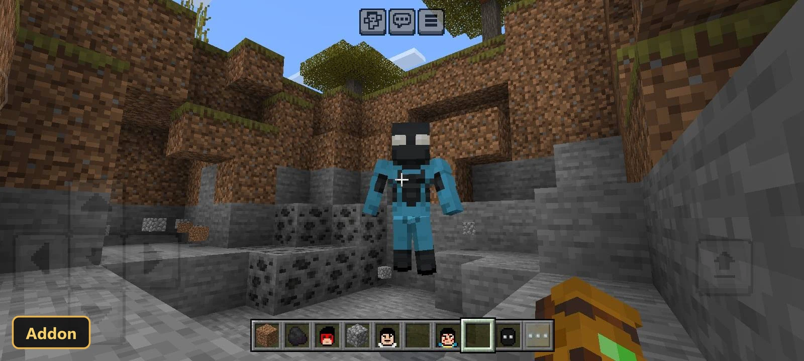 black-masked character skin in a rocky cave entrance