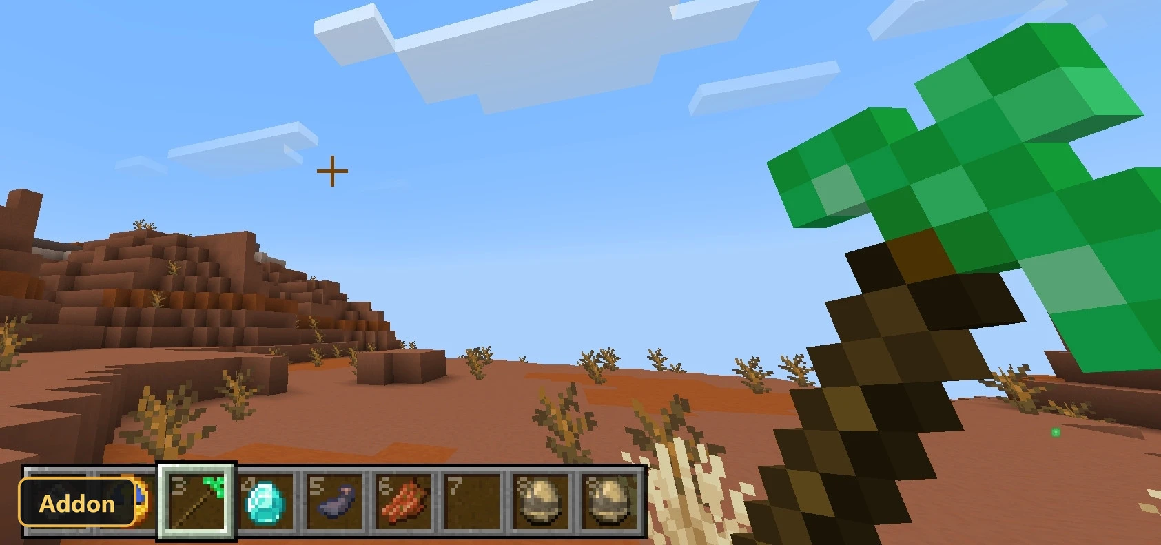 desert biome, daytime, holding a green pickaxe, red rock formations