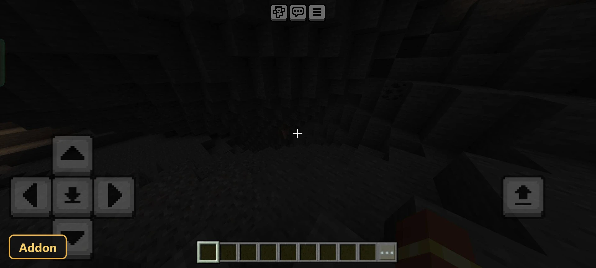 dark cave interior with visible block textures and faint light