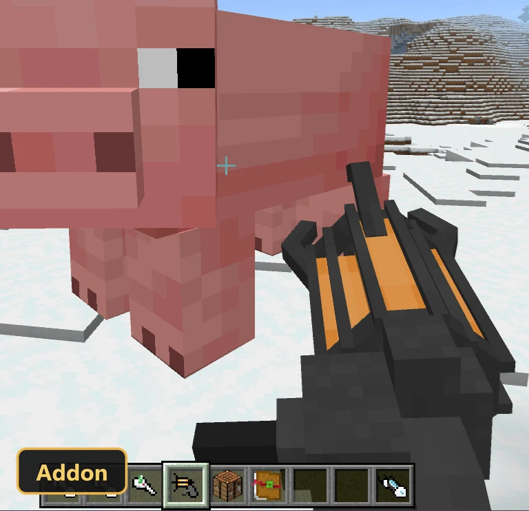 first-person view of a futuristic weapon aimed at a pig in a snowy biome