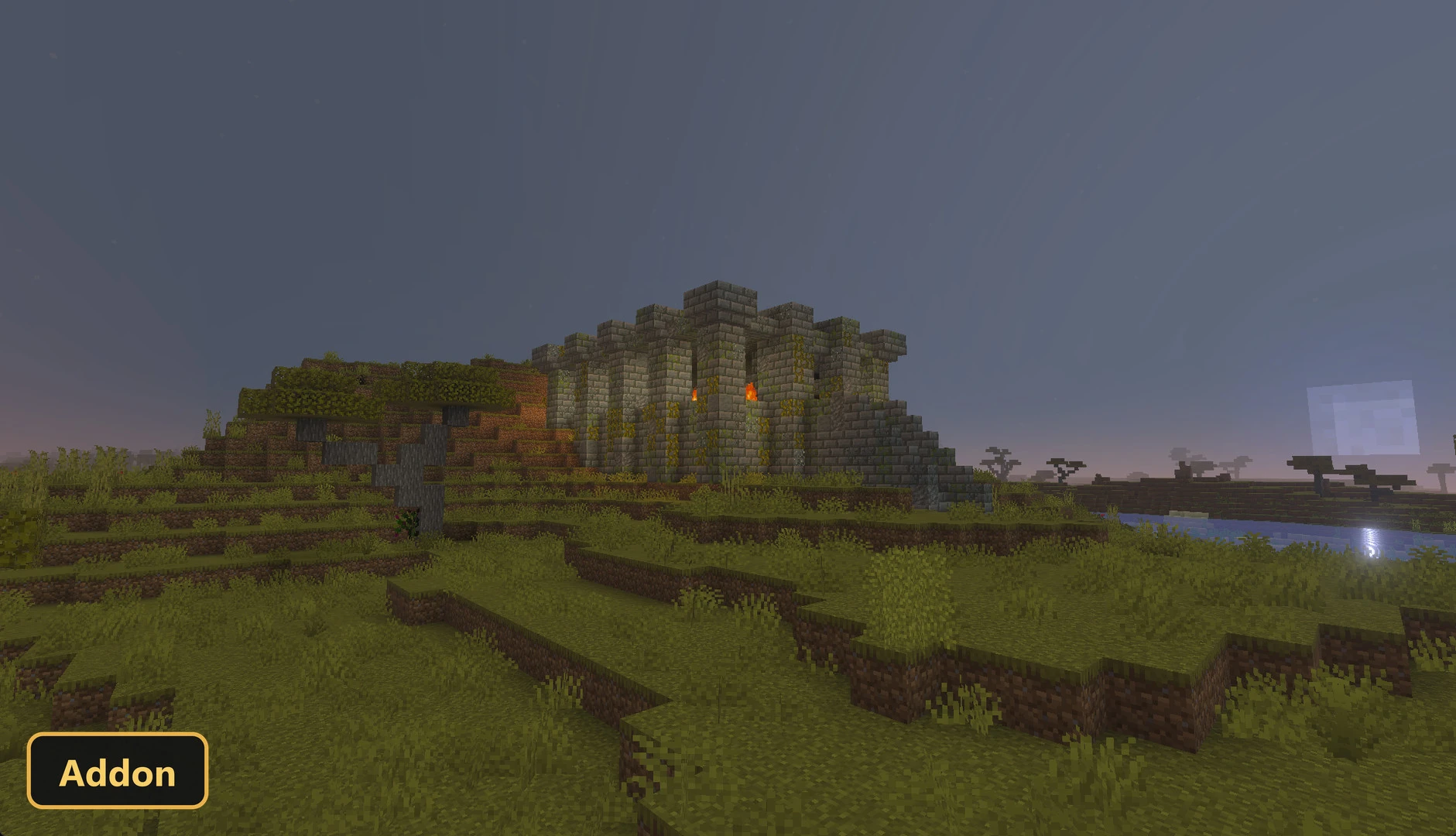 stone fortress on a grassy hill at dusk, with glowing orange windows