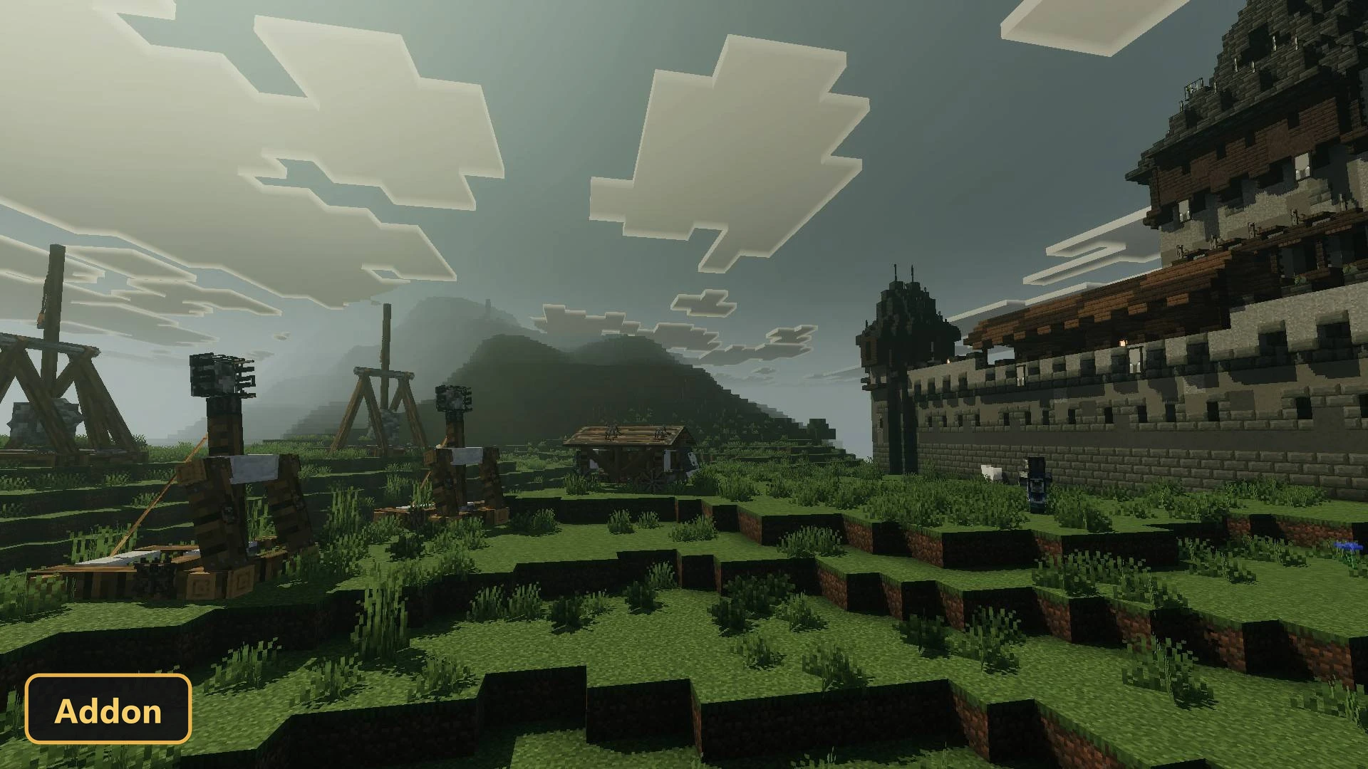 grassy field with siege weapons and a distant castle under cloudy sky