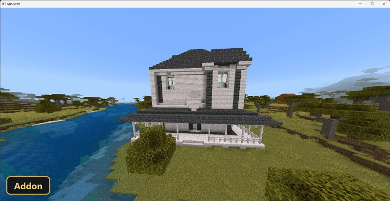 large white and grey house next to a river in a savanna
