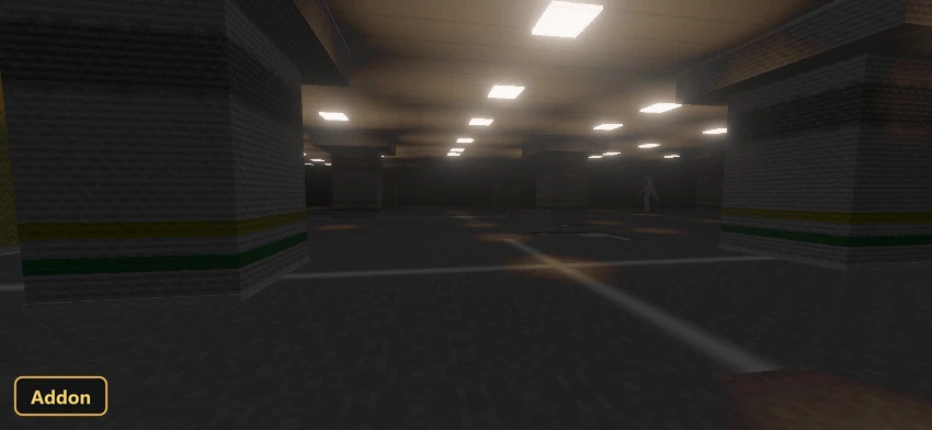 a dark, empty parking garage with a distant figure