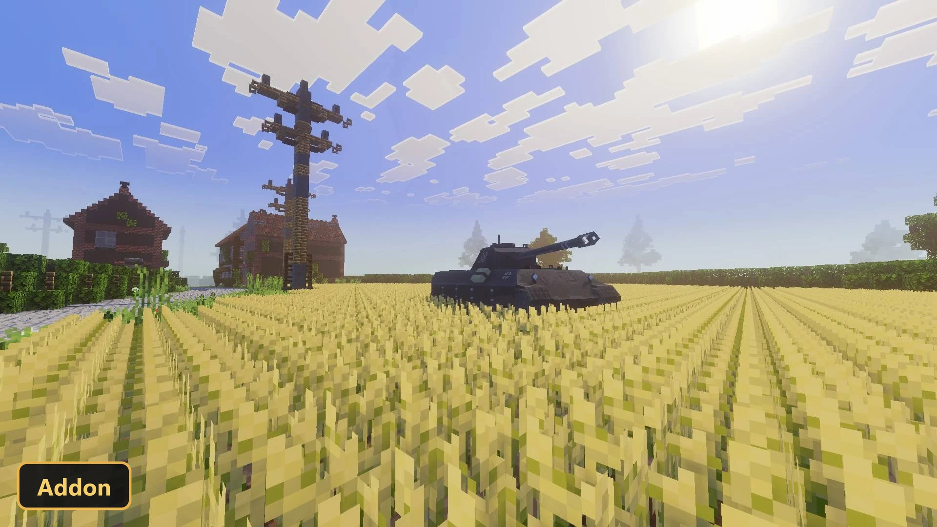 a dark tank in a field with houses and a utility pole