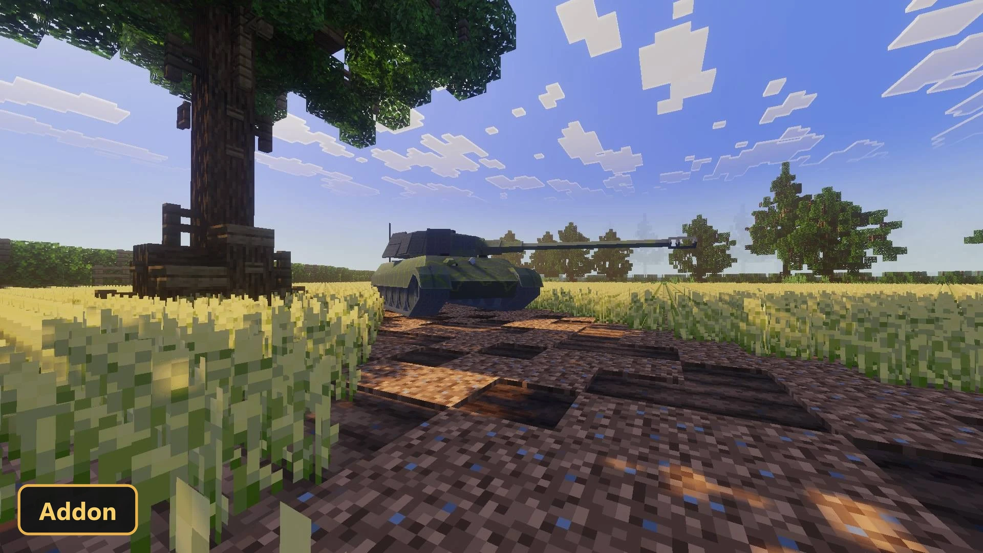 a green tank on a dirt path next to a large tree