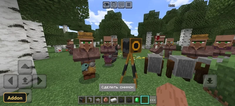 in-game scene with villagers and a camera on a tripod