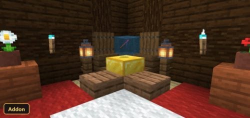 a golden block and a blue block on a wooden pedestal