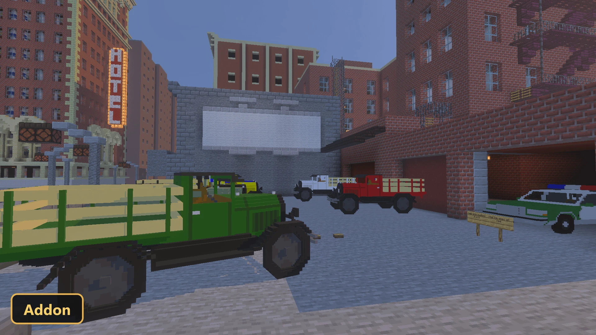 various trucks and a police car parked in a city