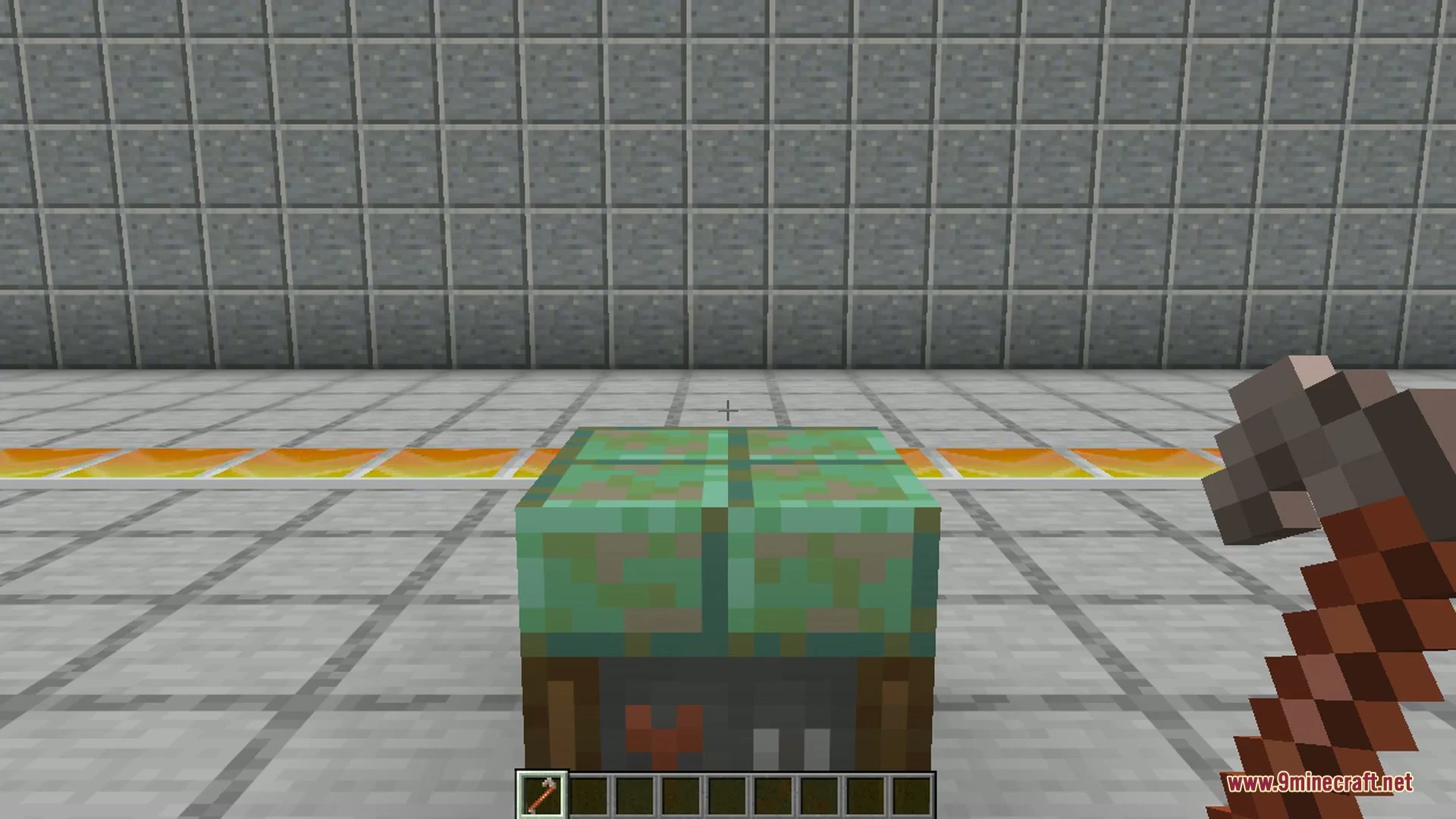 A small white car parked on a grassy hill in Minecraft