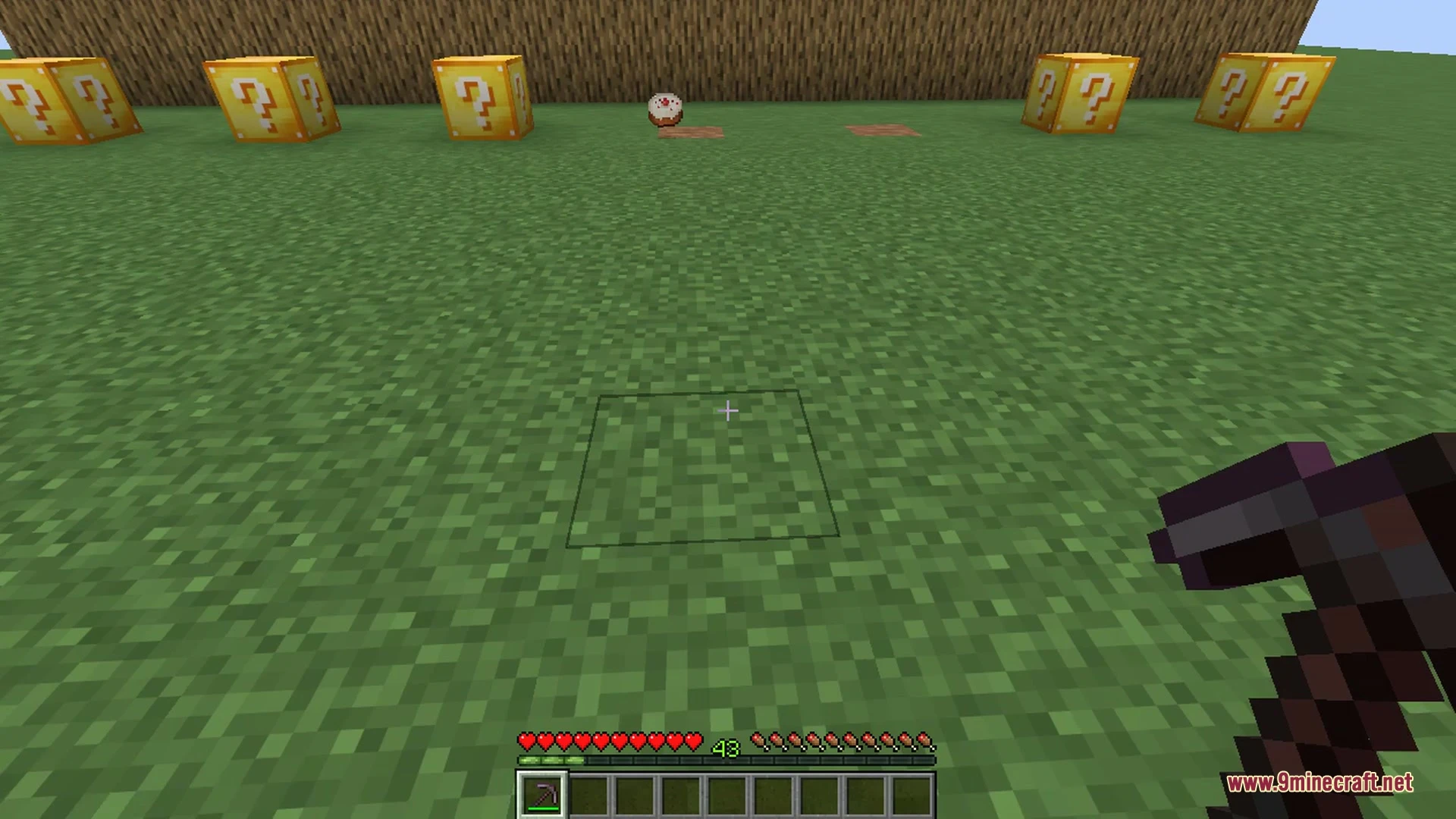 Colorful wool blocks and items scatter across the floor of a stone dungeon